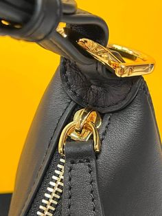 Small hobo bag made of soft black leather, with vintage gold metal FENDI lettering visible when the bag is under the arm.Zip closure with fabric-lined internal compartment, gold-finish metalware.Can be under the arm or cross-body thanks to the adjustable, detachable handle and the hooks that allow a shoulder strap to be attached.Delivery 5-8 or 10-15 working days Please note that during high season and Sale period, delivery times may be affected We accept payment with a Credit card, Debit card, Soho Disco Bag, Black Leather Bag, Nylon Tote Bags, Brown Handbag, Monogram Bag, Black Leather Bags, Louis Vuitton Shoulder Bag, Branded Handbags, Fendi Bags