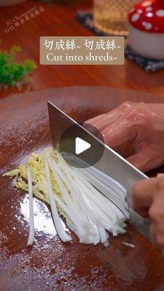 a person cutting onions with a large knife