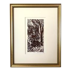 a black and white drawing in a gold frame