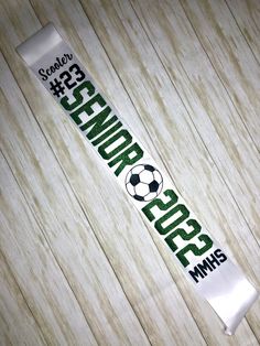 this is an image of a soccer banner on the wood floor that says science space