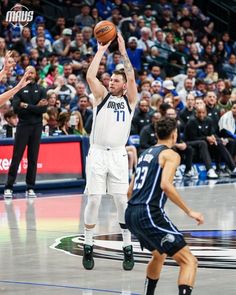 a basketball player taking a shot during a game