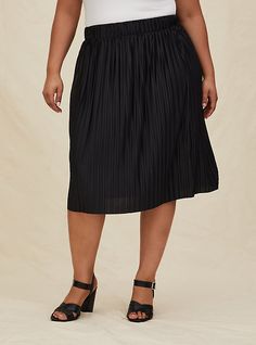 Twist and twirl into pleated perfection with this knitted midi skirt. Style with a cami tucked in for a feminine option! Stretch waistband. Accordion pleats. Raw hem. CONTENT + CARE  Polyester/spandex. Wash cold; dry low. Imported plus size skirts. SIZE + FIT Model is 5'10”, size 1. Size 2 measures 29” from waist to hem. The best plus size women's black accordion pleated midi skirt mini skirts in deep black made of knit. Midi Skirt Style, Knitted Midi Skirt, Black Pleated Midi Skirt, Accordion Skirt, Scuba Skirt, Button Midi Skirt, Asymmetrical Midi Skirt, Black Sequin Skirt, Coral Skirt