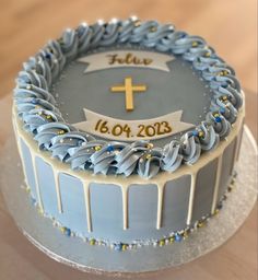 a cake decorated with blue icing and gold sprinkles