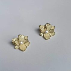 DESCRIPTION: Beautiful white flower freshwater pearl stud earrings, featuring an elegant floral design. These dainty earrings add a touch of sophistication to any outfit and make a perfect gift for her on special occasions. BEST FEATURES: Made with genuine white freshwater pearls for a lustrous and timeless look. Unique floral shape adds a feminine touch, perfect for various styles.  Designed for all-day wear without any discomfort. Easily pairs with casual and formal outfits, enhancing any look Gold Flower Earrings, Customer Gifts, Formal Outfits, Earrings Elegant, Earrings Dainty, White Freshwater Pearl, Elegant Floral, Dainty Earrings, Pearl Stud Earrings