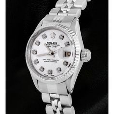 Absolutely gorgeous rolex. Very fine Stainless steel watch. Perfect craftsmanship rolex is well known for. In mint condition. Rolex Oyster Perpetual Datejust series. Gender: Women Movement: Fully Automatic movement winds itself when worn. Case: Stainless steel oyster case Bracelet: Stainless steel jubilee bracelet with folding clasp. Dial: White dial with approx. 0.40 carat F VS1 diamonds (Custom added) Bezel: Fluted Case Size: 26mm Condition : Mint. Looks brand new, well polished, no scratches Classic White Diamond Watch With Date Display, Classic White Watches With Jubilee Bracelet, Classic White Watch With Jubilee Bracelet, Rolex Oyster Perpetual Datejust, Vs1 Diamond, Oyster Perpetual Datejust, Bracelet Tennis, Rolex Oyster Perpetual, Rolex Oyster