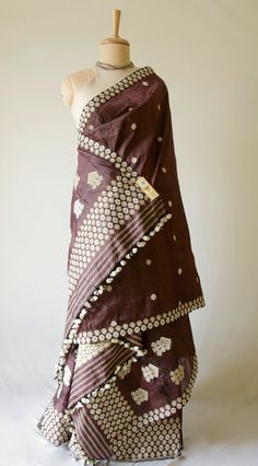 A genuine handloom Traditional Mekhla Chadar from our looms in Assam , India. The Mekhla Chadar has Mulberry Silk in the warp and dyed Tassar in the weft . The Mekhla and Chador is a traditional 2 piece dress from the North East State of Assam, India . The Mekhla is appx a 2 .5 meters by 36 Inches fabric , which is used as a lower wrap / skirt by Assamese Women. The Warp will have pleats when worn. The top part or 'chadar ' is a shawl or half -sari which is used to cover the upper portion of the Wine Colour Silk Saree Wedding, Mekhla Chador Look, Brown Embroidered Traditional Wear, Brown Chanderi Dupatta With Traditional Patterns, Designer Brown Chanderi Dupatta, Brown Chanderi Traditional Wear For Festivals, Brown Chanderi Traditional Wear, Brown Cutdana Embellished Dupatta For Navratri, Brown Cutdana Dupatta For Navratri