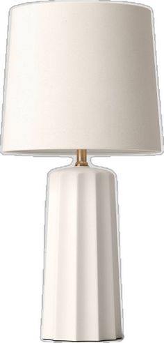 a white table lamp with a beige shade