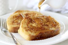 french toast with caramel sauce being drizzled on top