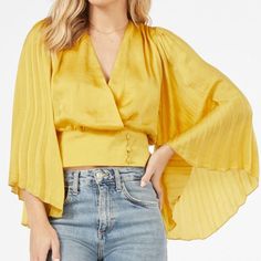 Posh Ambassador-Fast Shipper Same Day/Next Day Shipping Brand: Favlux Color: Sulphur Yellow Size: S (4/6) Bust: 34.5-35.5 Waist: 26.5-27.5 Flowy Pleated Sleeves Wrap Front Detail With Button Closure Fabric Type: 100% Polyester This Brand New Blouse Is Ready To Ship Out Today! Chic Yellow Cropped Tops, Chic Cropped Yellow Tops, Chic Yellow Cropped Blouse, Chic Yellow V-neck Top, Elegant Yellow Blouse For Brunch, Elegant Yellow Tops For Brunch, Chic Yellow Top For Brunch, Gold Blouse For Spring Day Out, Pleated Sleeves Blouse