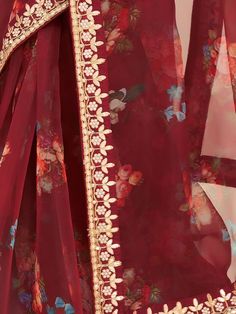 Spread the aura of freshness with our fascinating Maroon Floral Printed Organza Festival Wear Saree. This saree is perfect for adding a touch of elegance and charm to any occasion, be it a party, festival, or special function. Crafted with utmost care, this saree is made from high-quality organza fabric, known for its lightweight and sheer texture.
The prominent maroon color of this saree is beautifully adorned with intricate floral print work all over. The exquisite detailing of gota patti and Marron Color, Organza Material, Dori Work, Maroon Saree, Printed Organza, Color Party, Color Blouse, Party Wear Saree, Blouse Material