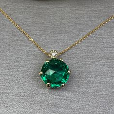 "The is a round emerald and diamond pendant necklace set in 14k solid gold.  This  dainty layering minimalist emerald green stacking ladies pendant necklace makes a great anniversary, birthday, mothers day, valentines day, Christmas, holiday gift. To re-visit our store click here: https://etsy.me/3Pzzwpx for emerald earrings click here: https://etsy.me/3AN4nqW for emerald rings click here: https://etsy.me/3JIov0a for emerald pendants click here: https://etsy.me/3Td2gnv -Approximate total carat w Sentimental Necklace, Necklace Emerald, Emerald Rings, Unique Pendant Necklace, Christmas Necklace, Pink Car, Emerald Pendant, May Birthstone, Emerald Necklace