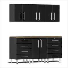 two black cabinets and one white cabinet with drawers on each side, both in front of the same wall