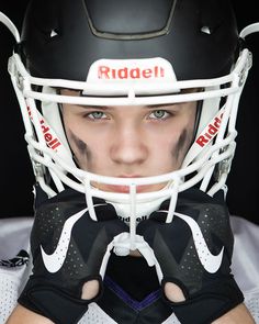 a close up of a person wearing a helmet and gloves