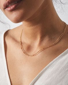 A unique layering chain - wear it solo or layer it with your other favorites. Details Made with Love: This piece is made with high quality 14kt gold filled, rose gold filled or sterling silver metals that are hypoallergenic. Each piece is hand assembled and packaged by our team in California. 1.2mm satellite chain, spring ring clasp + chain extender Select your adjustable chain length of choice. Note: If you want your chain made to a set length with no chain extender, just leave that info in the