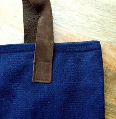 You are getting a unique handbag, since no two bags are alike. A great handbag to use like going-out bag, work bag, casual bag and more.  In this handbag we use a  Japanese Shibori technique, then dyed in natural indigo to make this pattern. All the process is handmade.  This handbag is made of 100% cotton denim, dyed in natural indigo obtained from Añil plant. With brown leather handles, a dark blue cotton lining and an always very useful inner pocket. Approx., measurements:Height:  14 1/2 inWi Blue Handheld Shoulder Bag With Leather Handles, Blue Cotton Bags With Leather Handles, Waxed Canvas Tote Shoulder Bag With Handles, Artisan Blue Tote Bag, Blue Canvas Bag With Leather Double Handles, Blue Canvas Bag With Double Leather Handles, Blue Rectangular Waxed Canvas Bag, Rectangular Blue Waxed Canvas Bag, Handmade Blue Canvas Bag For Daily Use