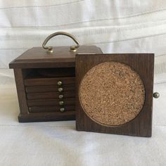 a small wooden box with cork in it