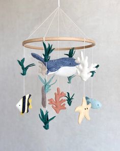 a mobile with sea animals hanging from it's sides