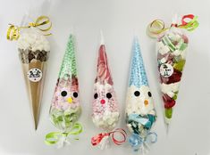 three cones filled with candies and candy in the shape of animals