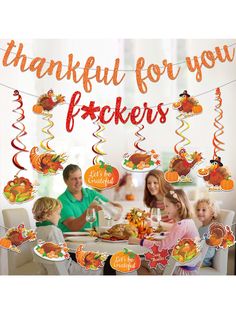 a group of people sitting around a table with turkey decorations on it and the words, thank you for your fockers