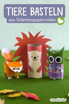 three paper animals are sitting next to each other in front of a green background with the words, tiere basteln aus tolltempapierollien