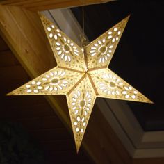 a star shaped light hanging from the ceiling