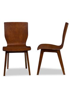 two wooden chairs sitting next to each other