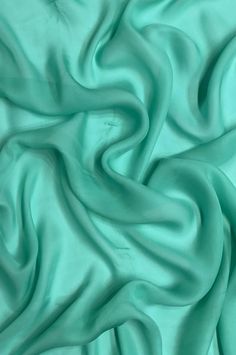 a close up view of a green fabric