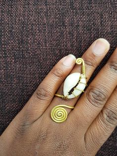 hand finger ring made of brass. Listing is for 5 brass ring. These rings are handmade using brass and decorated with a cowrie shell. All items are shipped through dhl express. Ring Finger Rings, Rings Hand, Hand Finger, Brass Rings, Rings Rings, 5 Rings, Hand Ring, Finger Rings, Cowrie Shell