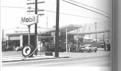 black and white photograph of an old gas station