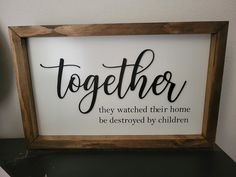 a sign that says together they watched their home be destroyed by children on the shelf