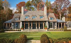 this is an image of a house in the country side with lots of windows and doors