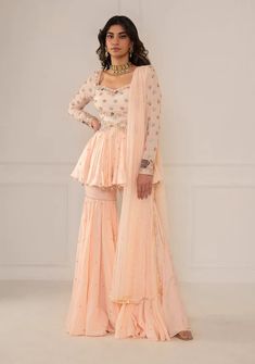 Mani Bhatia | Tea Pink Peplum Garara Set | INDIASPOPUP.COM Diwali Outfit Ideas For Women 2024, Peplum Gharara, Plazo Kurti, Sharara Dress, Diwali Ideas, Outfit Traditional, Sharara Designs, Suit Styles