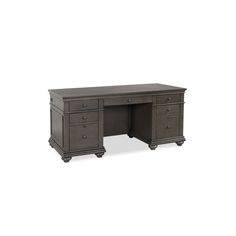 an office desk with two drawers and one drawer on the top, in dark wood