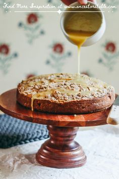 the cake is being drizzled with honey