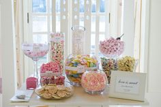 a table topped with lots of candy and candies