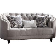 a gray couch with pillows on top of it