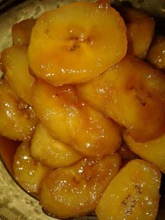 some bananas are sitting in a bowl on the table and it looks like they have been cooked