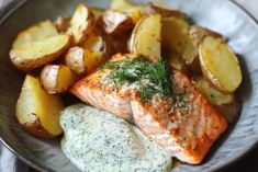 salmon, potatoes and herbs on a plate