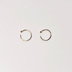 + TINY GOLD HUGGIE +TINY GOLD HUGGIE earrings made in Solid 14k Yellow Gold. Dainty open hoops with balls that hugs your ears. Shiny Yellow Gold hoops that you can wear everyday, literally. An everyday staple and heirloom. Perfect for your earlobes, cartilage or tragus. Wear 1 or a pair.+ 14ky Gold huggie hoops+ Sold as 1 single or pair + 2mm ball+ Please allow 3-5 business days to ship out. Minimalist Recycled Gold Huggie Earrings, Tiny Minimalist 14k Gold Cartilage Earrings, Minimalist 14k Rose Gold Huggie Earrings, Minimalist Yellow Gold Ear Cuff Tarnish Resistant, Minimalist Yellow Gold Tarnish Resistant Ear Cuff, Minimalist Yellow Gold Tarnish-resistant Ear Cuff, Minimalist 14k Gold Huggie Earrings, Nickel-free Minimalist Huggie Septum Ring, Tiny Gold Minimalist Huggie Earrings