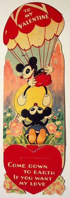 an old valentine's day card with mickey and minnie flying in a hot air balloon