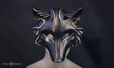 Take on the spirit of the black and silver Wolf with this resin masquerade mask! Perfect for Halloween, Masquerade parties, Renaissance Faires, or other fanciful festivities. ** Mask is HANDMADE TO ORDER in 2-3 weeks **  Wolf masks are cast from an original Dovah Design sculpt, making them a truly unique mask you will find nowhere else. Black wolf masks are cast using a super black Urethane resin, topped with satin enamel, and finished with hand painted acrylic silver detailing. Each mask is made by hand in the Dovah Design workshop, and comes with a soft foam nose padding affixed to the inside. Each mask is hand made by "slush casting" resin in several layers. Each mask is hand finished with acrylic paint. Masks are top coated with clear Satin enamel to help preserve painted details. Mask Wolf Masks, Bear Mask, Kitsune Mask, Unique Masks, Wolf Mask, Casting Resin, Silver Highlights, Design Workshop, Costume Inspo