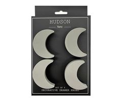 three moon shaped magnets in a package on top of a white background with the words hudson