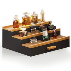 three wooden shelves with different types of perfumes on them