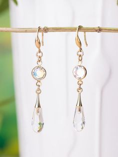 Swarovski gold filled drop earrings. Sparkly earrings and beautiful color combination.Measurement & Details:•Total Earring length: 2" inch (5 cm)•Color: Gold and clear AB •Ear wires and components: Gold filled. High quality plated. Anti tarnish.•       These earrings will arrive in a jewelry gift box, ready for gift giving or safe keeping.For more beautiful earrings:http://etsy.me/2aiNAz5My shop:http://etsy.me/2bOhgFaThank you for visiting,If you have questions or requests, please don't hesi Delicate Bridal Earrings, Moonstone Earrings Gold, Black Crystal Earrings, Hand Beaded Necklace, Jewelry Casual, Crystal Heart Earrings, Blue Crystal Earrings, Cleaning Silver Jewelry, Earrings Teardrop