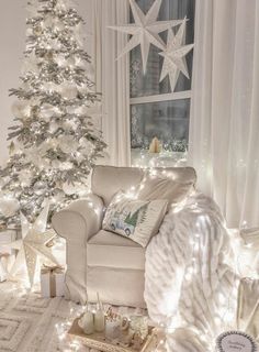 a white christmas tree in a living room