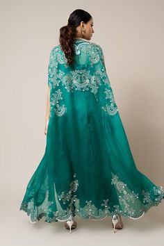 Sea green organza shoulder-gathered cape with mirror, swarovski, metallic sequins, studs and pearls hand embroidery. Comes with a satin knotted skirt and a crepe scallop blouse. - Aza Fashions Festive Evening Dupatta In Cape Style, Evening Festive Cape Dupatta, Festive Evening Cape-style Dupatta, Festive Evening Cape-shaped Dupatta, Festive Evening Cape Dupatta, Elegant Party Cape-shaped Dupatta, Elegant Party Dupatta Cape, Elegant Party Cape Dupatta, Party Organza Dupatta With Cape Sleeves