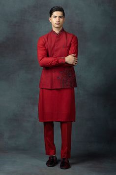 Red waist coat with dobby floral placement work. Comes with red kurta and pant.
Components: 3
Pattern: Embroidered
Type Of Work: Floral
Neckline: Mandarin
Sleeve Type: Waist Coat: Sleeveless, Kurta: Long
Fabric: Silk
Color: Red
Other Details: 
Kurta:
Embroidered cuff sleeves
Waist Coat:
Pintucked details
Contrast floral work
Occasion: Wedding - Aza Fashions Festive Long Sleeve Nehru Jacket For Work, Designer Red Traditional Wear For Festive Occasions, Designer Red Traditional Wear For Festive Season, Traditional Festive Outerwear For Work, Elegant Designer Cotton Nehru Jacket, Formal Embroidered Cotton Nehru Jacket, Embroidered Nehru Jacket For Diwali Semi-formal Occasions, Embroidered Cotton Nehru Jacket For Formal Occasions, Elegant Cotton Nehru Jacket