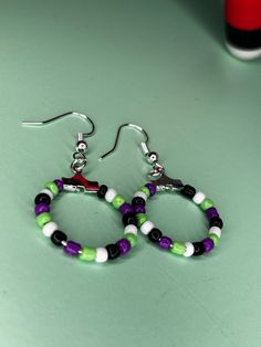 Beetlejuice inspired beaded hoops Beetlejuice Crafts Diy, Beetlejuice Diy, Beetlejuice Earrings Diy, Beetlejuice Jewelry Diy, Beetlejuice Clay Earrings, Beaded Beetle Juice Earrings, Beetlejuice Jewelry, Beetle Juice Earrings, Beetlejuice Accessories