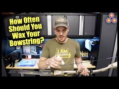 a man holding a bow and arrow in front of a computer screen with the words how often should you shod you walk your bowstring?