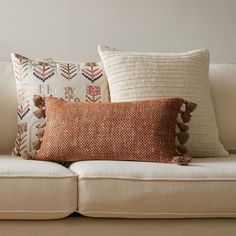 a couch with pillows on top of it